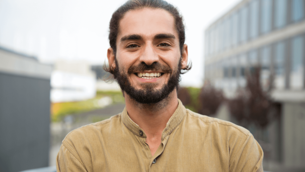 A smiling boy happily discussing his accident at work claims.