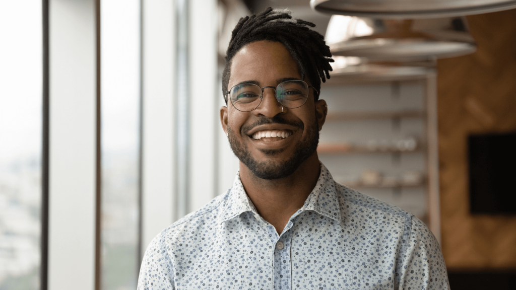 A smiling man feeling confident about his accident at work claims.