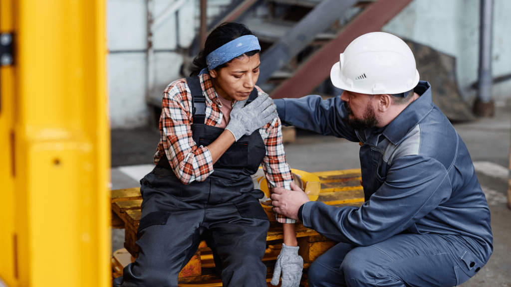 a woman getting help after an accident at work