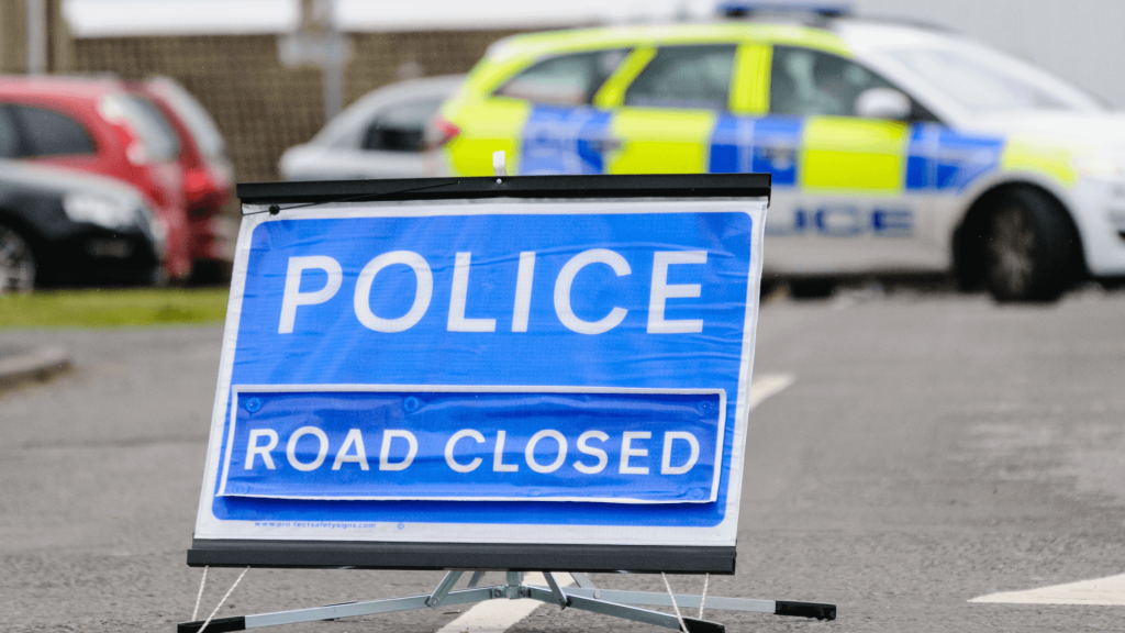 Police road closure following a road traffic accident for safety and investigation.