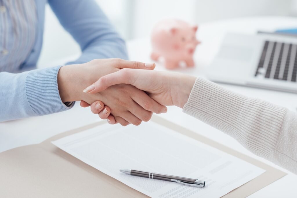 A solicitor and a client shaking hands after discussing fatal accident claims.