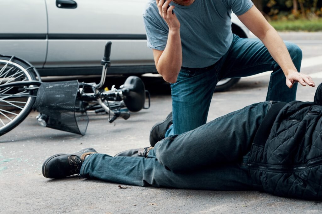 a driver phoning emergency services after a fatal road traffic accident